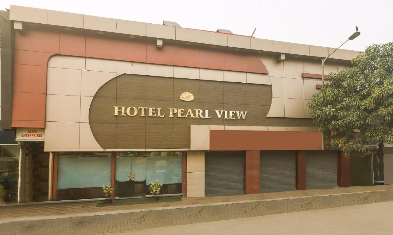 Hotel Capital O Pearl Near Us Embassy